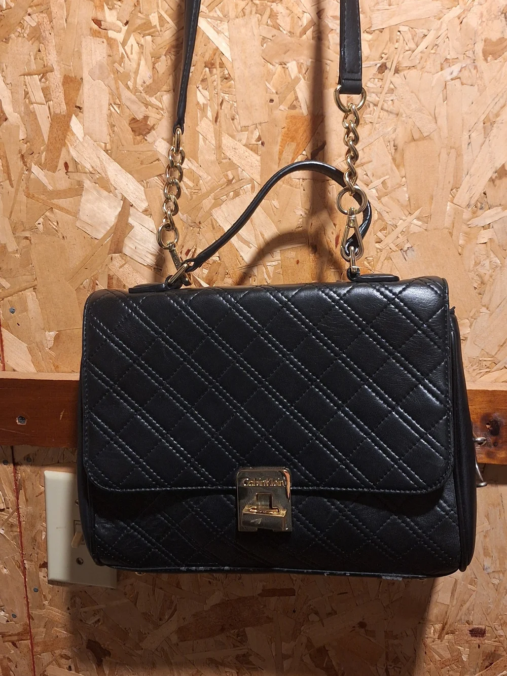 Black Quilted Satchel Handbag with Gold Hardware